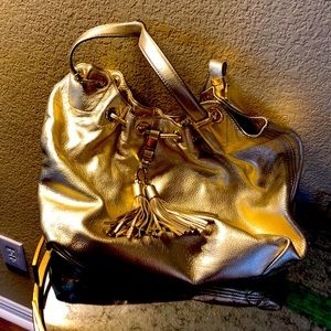 Michael Kors purse measures 13 x 14 and very gently used condition.